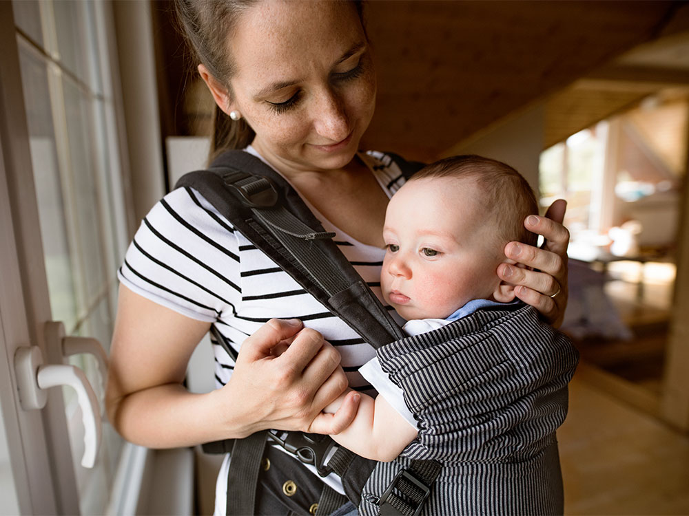 balancing baby carrier use