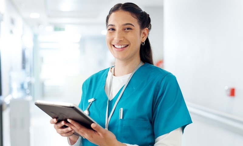 nurse holding a tablet