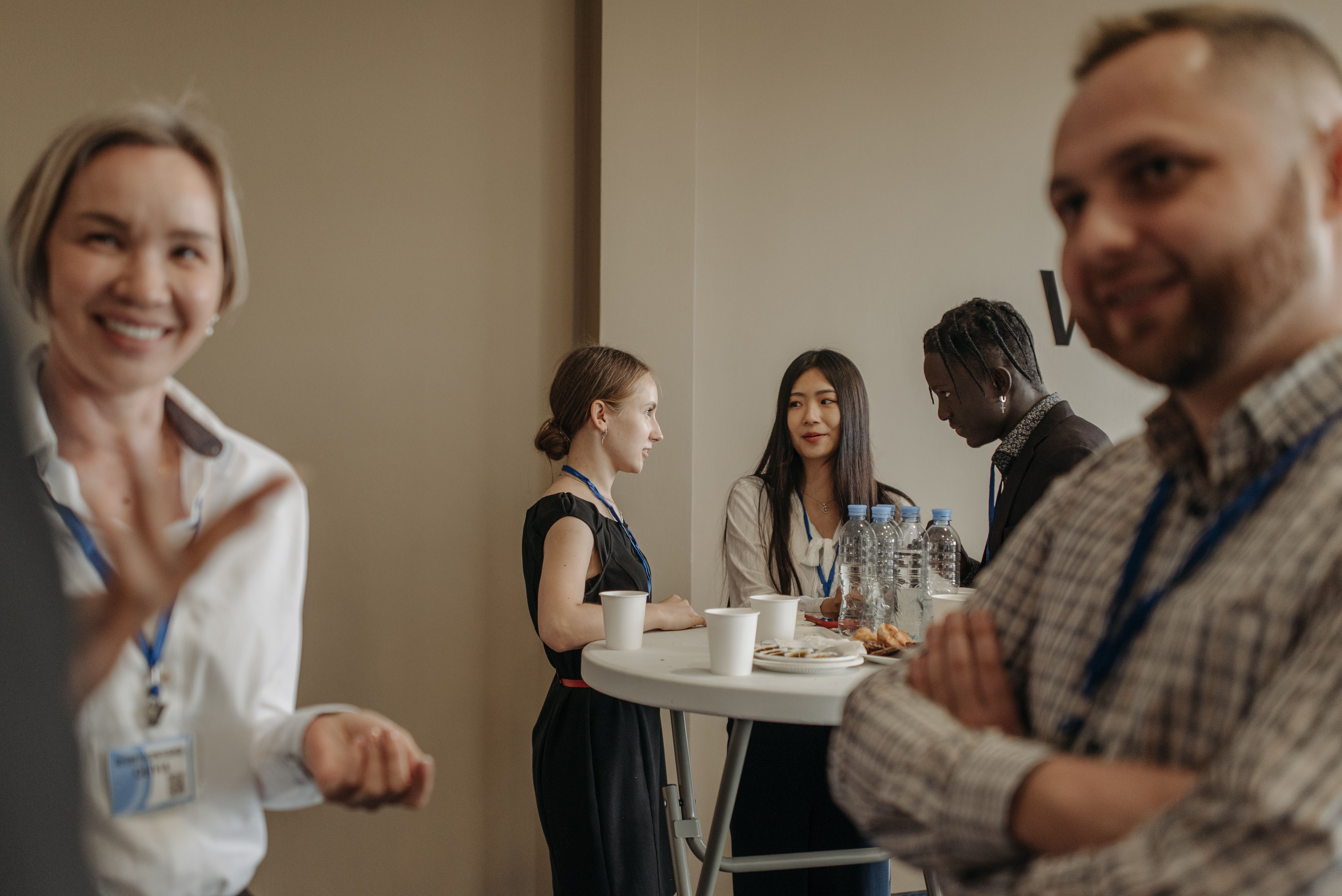 Diverse group of professionals networking confidently at a business event